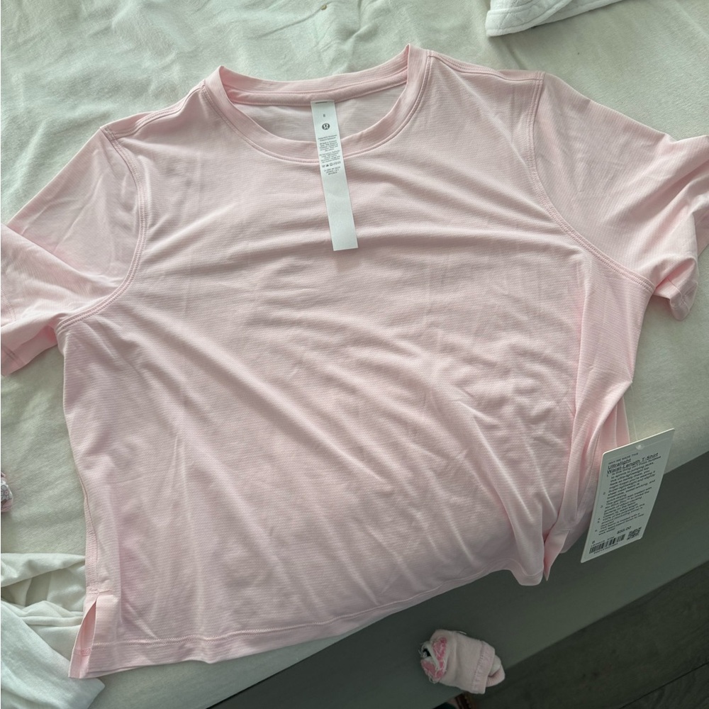 lululemon athletica Ultralight Waist length Light Pink Short Sleeve Top